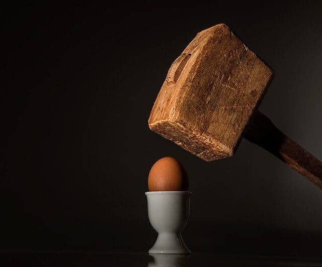 egg being hit with a hammer